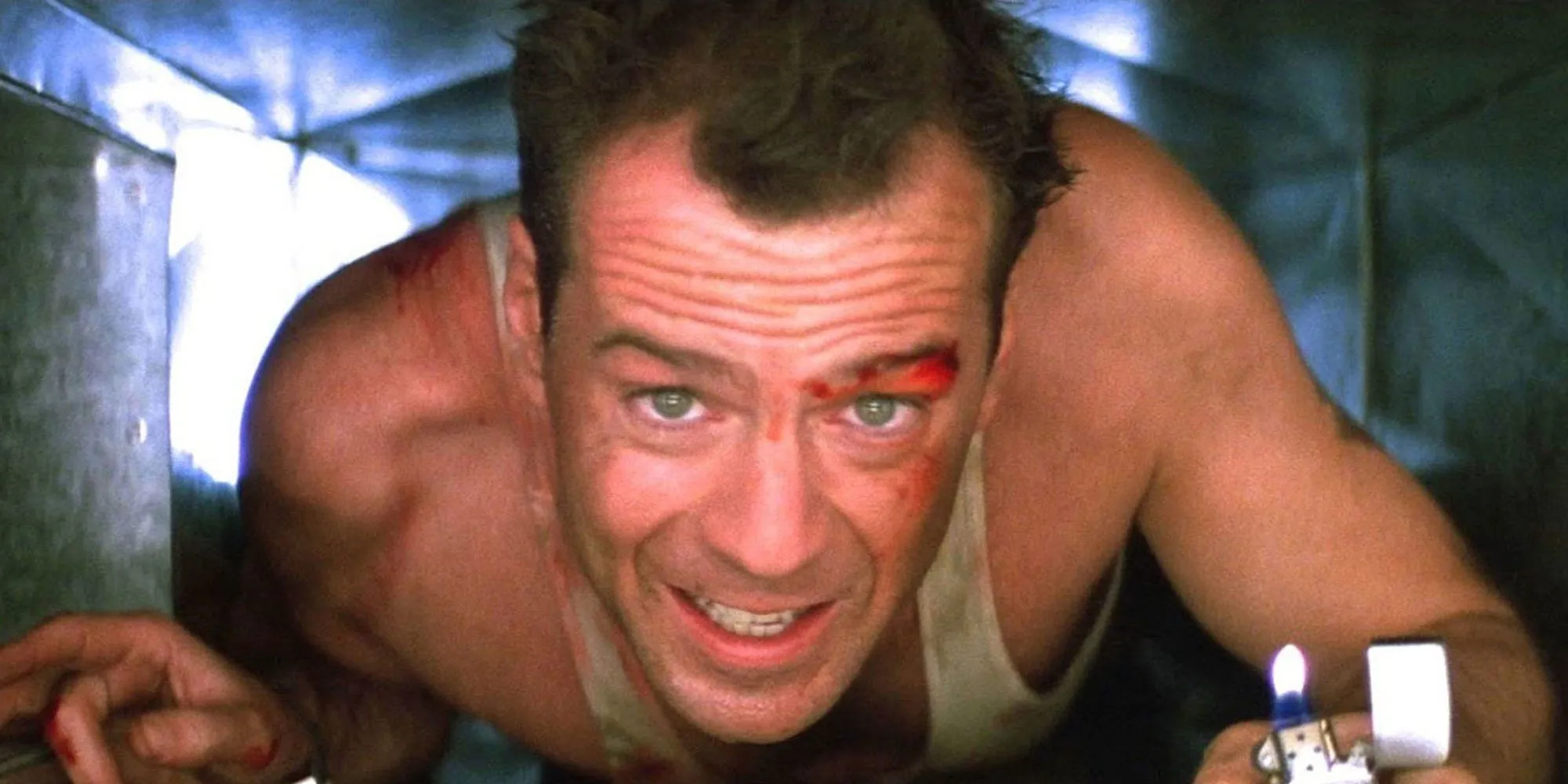John McClane crawling down a vent while holding a lighter in Die Hard.
